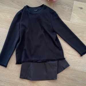 All Saints black long fringe sleeve with under skirt attached.